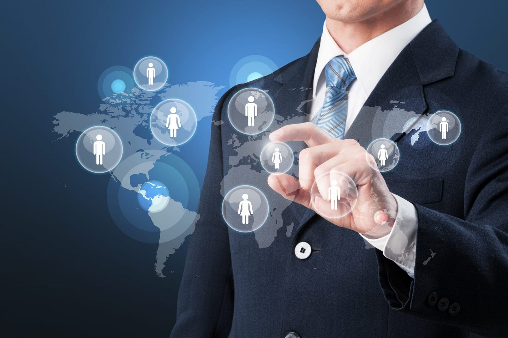 Global network concept with a businessman selecting people icons on a world map